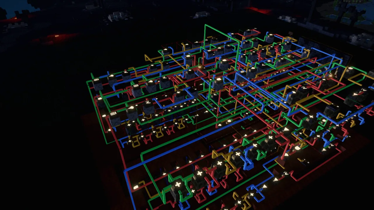 A big circuit board at night, red, green, blue and amber wires running between hundreds of gates