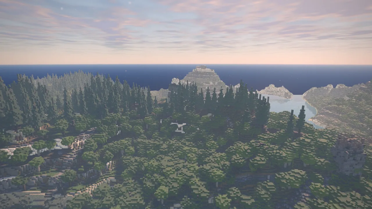 Forested country running down to a lake, the sea beyond