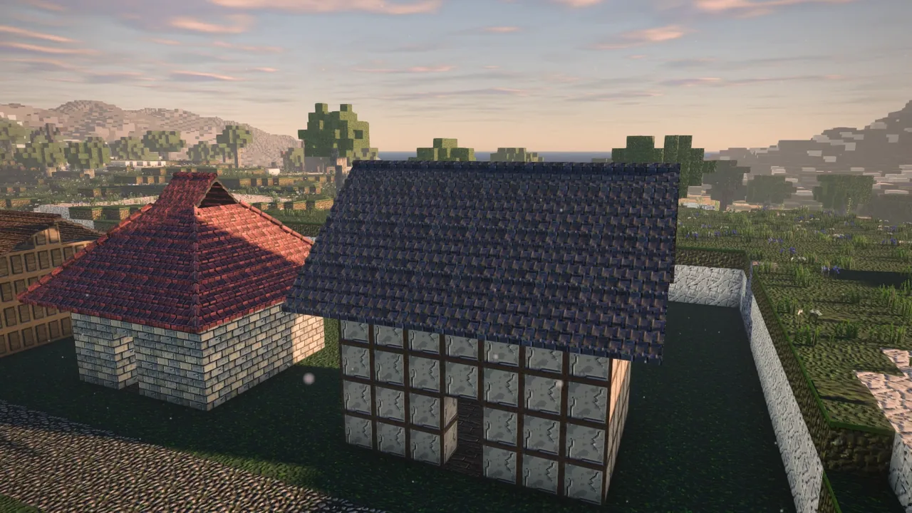Slate and red tile roofs with proper hips and valleys over half-timbered walls