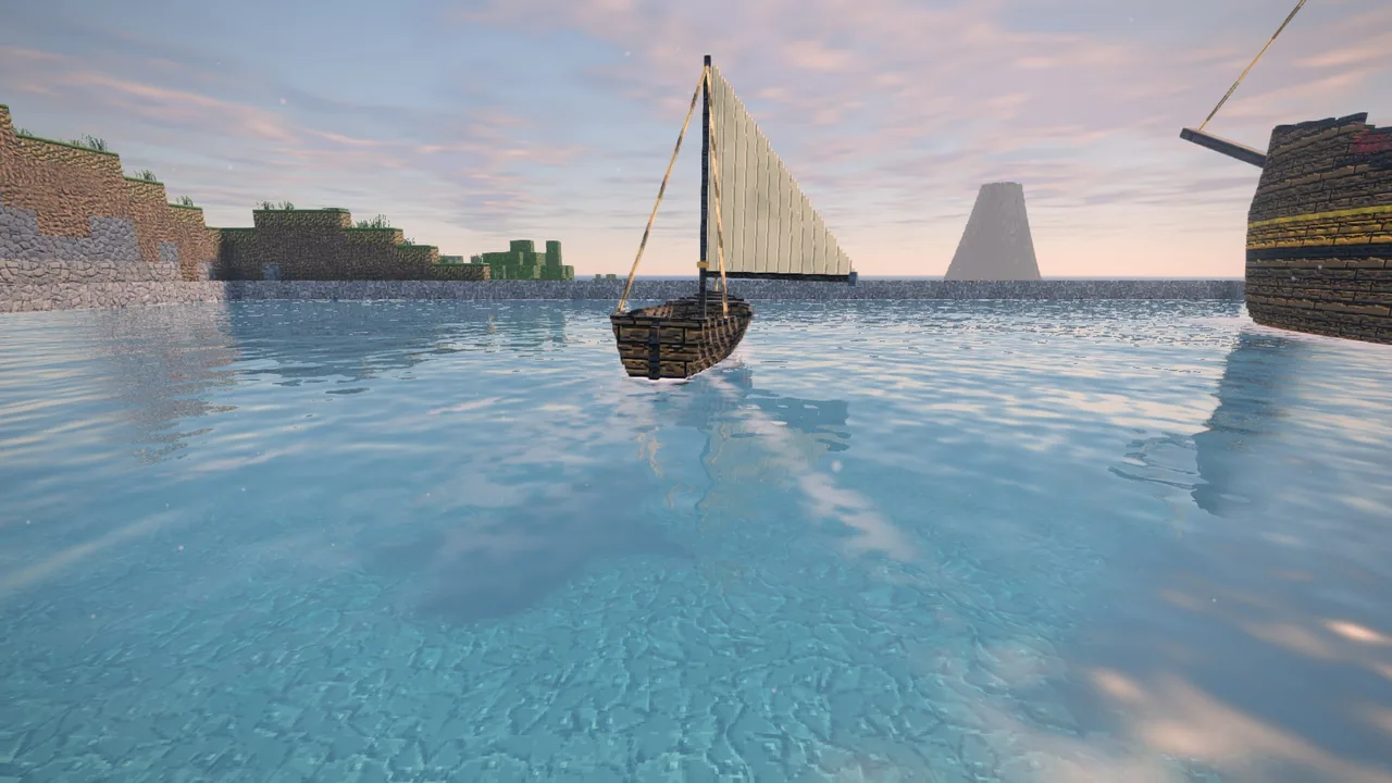 A sailboat under its single sail on calm water, a volcano on the horizon