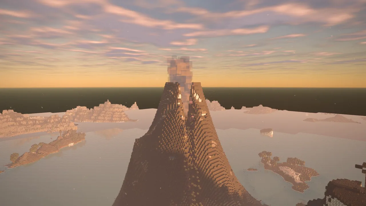 A volcano in the evening light, its plume rising