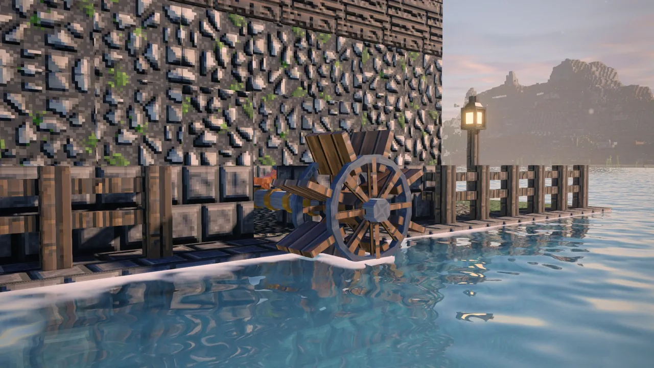 A water wheel turning in a mill race beside a stone mill